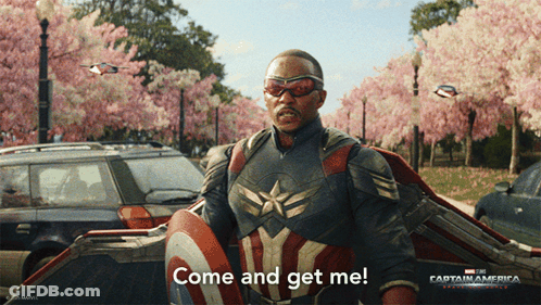 A Man In A Captain America Costume Is Holding A Shield And Saying Come And Get Me GIF