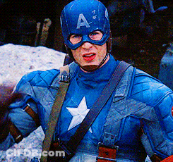 A Man In A Captain America Costume Is Wearing A Helmet With The Letter A On It GIF