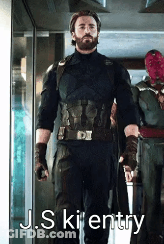 A Man In A Captain America Uniform Is Standing In A Hallway Next To A Man In A Vision Mask . GIF