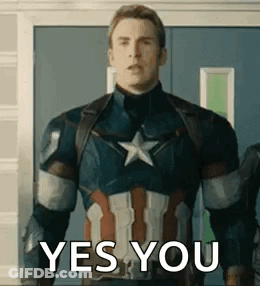 A Man In A Captain America Uniform Is Standing In Front Of A Door And Saying Yes You . GIF