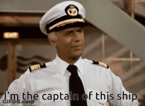 A Man In A Captain 'S Hat And Tie Says I 'M The Captain Of This Ship GIF