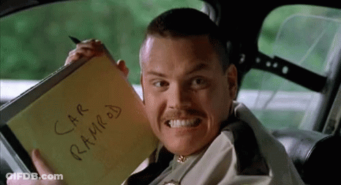 A Man In A Car Is Holding A Notepad That Says Car Ramrod On It GIF