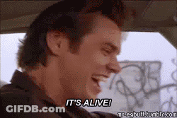 A Man In A Car Is Laughing And Saying It 'S Alive . GIF