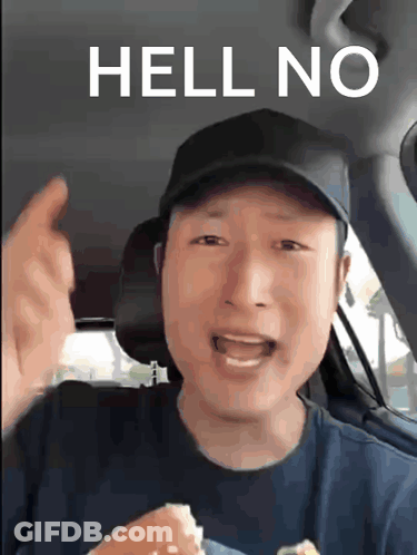 A Man In A Car Says Hell No While Holding A Hamburger GIF