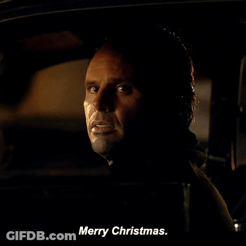 A Man In A Car Says Merry Christmas On The Screen GIF