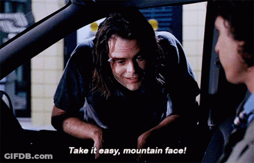 A Man In A Car Talking To Another Man And Says Take It Easy Mountain Face GIF