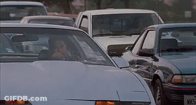 A Man In A Car With A License Plate That Says Wks GIF