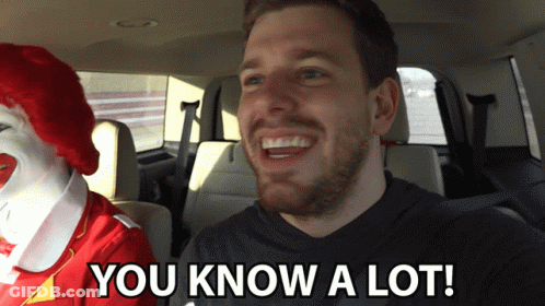 A Man In A Car With A Mcdonald 'S Clown Behind Him And The Words You Know A Lot GIF