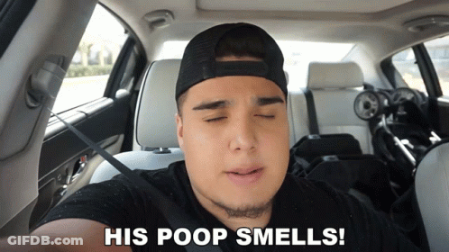 A Man In A Car With His Eyes Closed And The Words His Poop Smells Below Him GIF