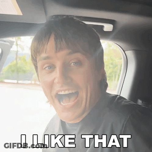 A Man In A Car With His Mouth Open And The Words I Like That Below Him GIF