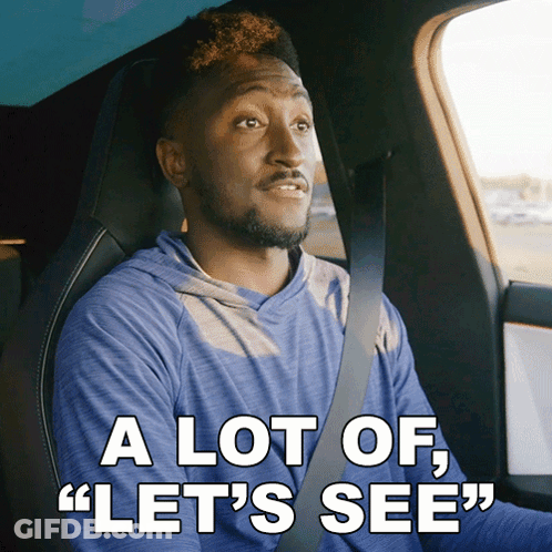 A Man In A Car With The Words " A Lot Of Let 'S See " Below Him GIF