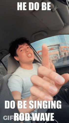 A Man In A Car With The Words He Do Be Do Be Singing Rod Wave On The Bottom GIF