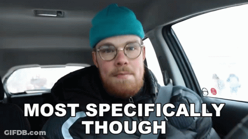 A Man In A Car With The Words Most Specifically Though GIF