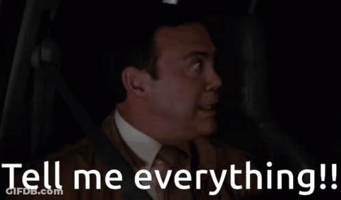 A Man In A Car With The Words Tell Me Everything Written Below Him GIF