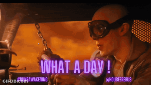 A Man In A Car With The Words What A Day Written On The Screen GIF