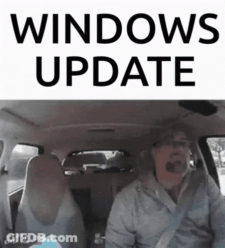 A Man In A Car With The Words Windows Update On The Top GIF