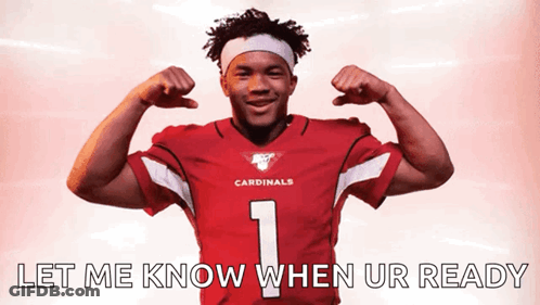 A Man In A Cardinals Jersey Flexing His Muscles GIF
