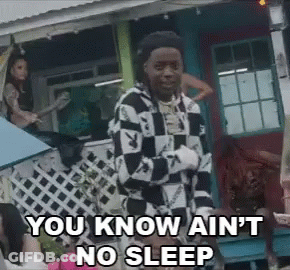A Man In A Checkered Shirt Is Standing In Front Of A House And Says You Know Ain 'T No Sleep GIF