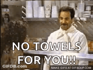 A Man In A Chef 'S Coat Is Standing In A Kitchen And Says `` No Towels For You ! `` GIF