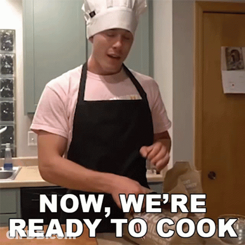 A Man In A Chef 'S Hat And Apron Is Saying Now We 'Re Ready To Cook GIF