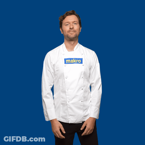 A Man In A Chef 'S Jacket Stands In Front Of A Blue Background With The Word Gracias Written In Yellow GIF