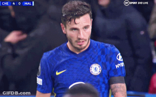 A Man In A Chelsea Jersey Holds His Head In His Hands GIF