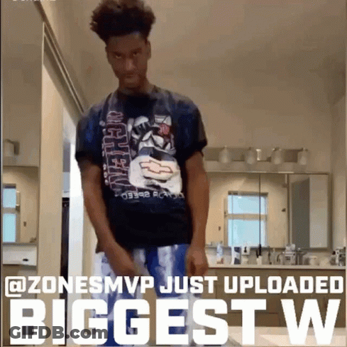 A Man In A Chevrolet Shirt Is Standing In A Bathroom With The Caption " Zone Smvp Just Uploaded Biggest W " GIF