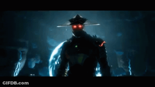 A Man In A Chinese Hat Is Holding A Glowing Object In His Hands GIF