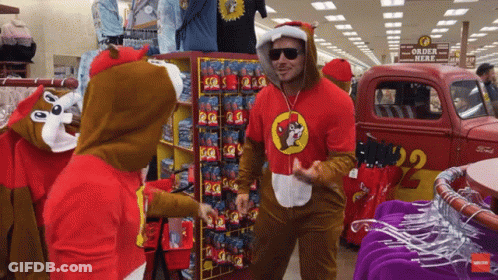 A Man In A Chipmunk Costume Stands In Front Of A Sign That Says " Order Here " GIF