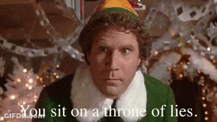 A Man In A Christmas Elf Costume Is Sitting On A Throne Of Lies In Front Of A Christmas Tree . GIF