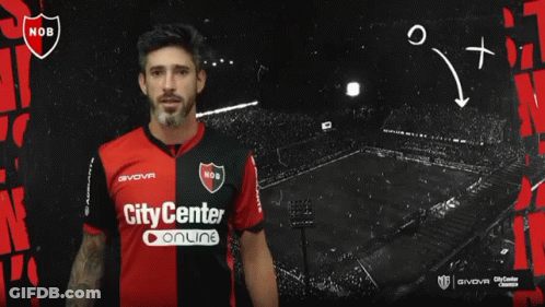 A Man In A City Center Online Jersey Stands In Front Of A Black Background GIF