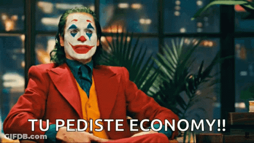 A Man In A Clown Costume Is Sitting In Front Of A Window And Says Tu Pediste Economy GIF