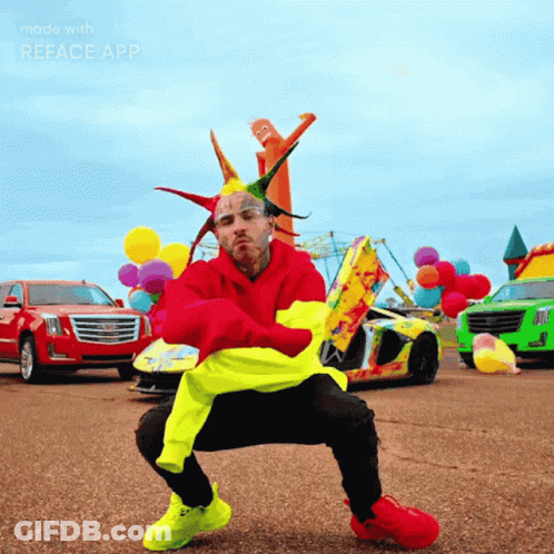 A Man In A Clown Costume Is Squatting In Front Of Cars And Balloons With The Words Made With Reface App Below Him GIF