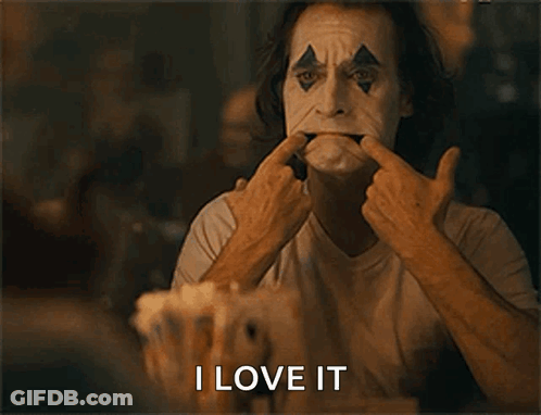 A Man In A Clown Mask Is Making A Funny Face And The Words I Love It Are Below Him GIF