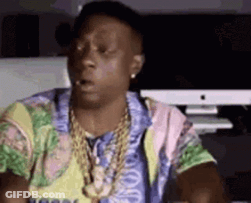 Man In Colorful Shirt And Gold Chains At Computer GIF