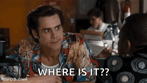 A Man In A Colorful Shirt Is Talking To Another Man And Says Where Is It GIF