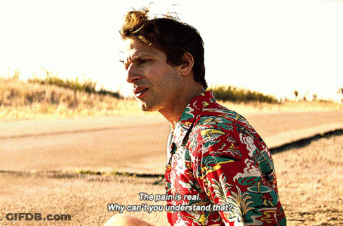 Man In Colorful Shirt Saying The Pain Is Real GIF