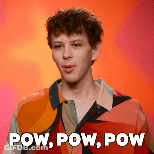 A Man In A Colorful Shirt With The Words Pow Pow Pow Behind Him GIF