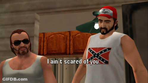 A Man In A Confederate Flag Tank Top Says I Ain T Scared Of You GIF