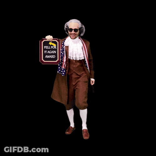 A Man In A Costume Holds Up A Plaque That Says Fell For It Again Award GIF