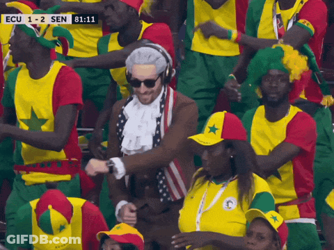 A Man In A Costume Is Dancing In A Crowd With Ecu 1-2 Sen Written On The Screen GIF