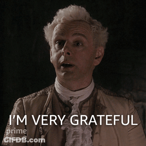A Man In A Costume Says I 'M Very Grateful On A Screen GIF