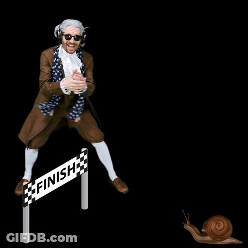 A Man In A Costume Stands In Front Of A Finish Line Sign GIF