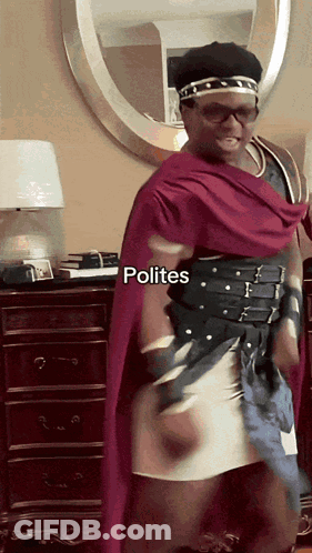 A Man In A Costume With Polites Written On The Bottom Right GIF