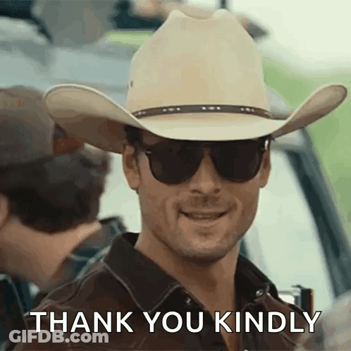 A Man In A Cowboy Hat And Sunglasses Is Smiling And Saying Thank You Kindly . GIF