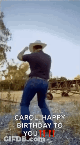 A Man In A Cowboy Hat Is Dancing In A Field And Says Carol Happy Birthday To You !! GIF
