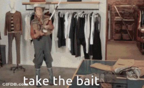 A Man In A Cowboy Hat Is Holding A Fishing Rod And The Words Take The Bait Are Above Him GIF