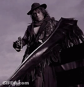 A Man In A Cowboy Hat Is Holding A Gun And A Large Sword GIF