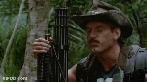 A Man In A Cowboy Hat Is Holding A Gun And The Name Jesse Ventura Is On The Bottom Right GIF