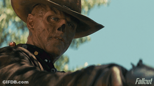 A Man In A Cowboy Hat Is Holding A Gun With Fallout Written On The Bottom Right GIF